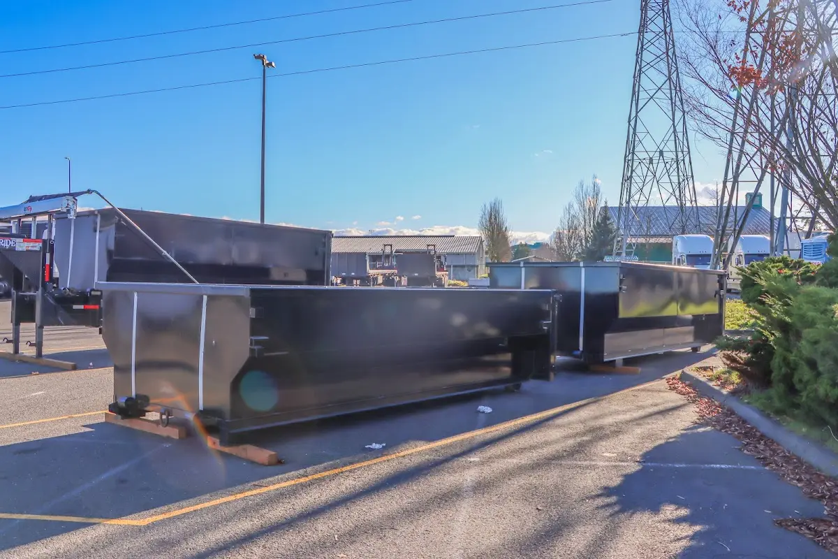 Roll-off dumpster ready for waste disposal at job site for Concrete Dumpster Rental in Carroll